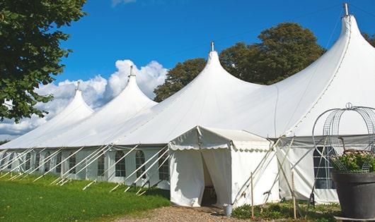 high-quality portable toilets stationed at a wedding, meeting the needs of guests throughout the outdoor reception in Penney Farms